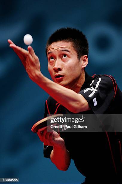 Kaii Yoshida of Japan serves to Li Ching of Hong Kong, China during the Men's Table Tennis Team Quarter Finals at the 15th Asian Games Doha 2006 at...