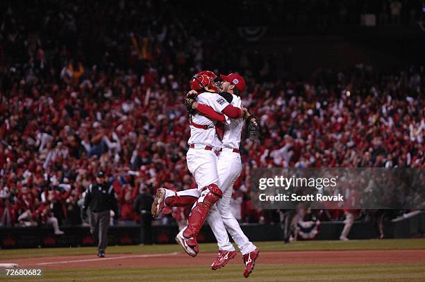 Adam Wainwright and Yadier Molina celebrate after defeating the Detroit Tigers in the World Series during game 5 at Busch Stadium in St. Louis,...