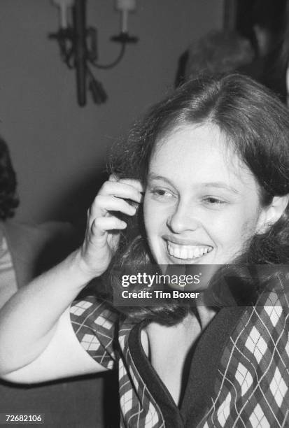 American actress Sandy Dennis laughs in an unidentified restaurant, 1969.