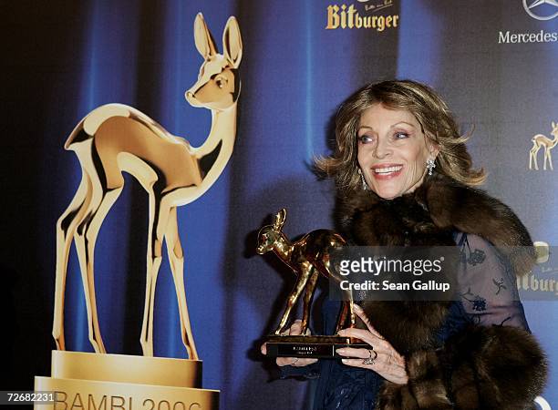 Veronique Peck, widow of late actor Gregory Peck, holds the Bambi Award that is to replace the one won by Mr. Peck many years ago but lost, at the...