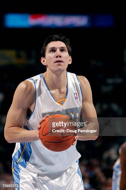 Eduardo Najera of the Denver Nuggets shoots a free throw against the Chicago Bulls during the game on November 21, 2006 at the Pepsi Center in...