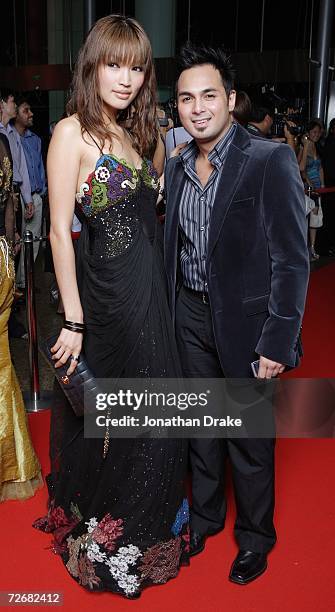 Malaysian model Amber Chia, and Philippine actor Keempee de Leon pose on the red carpet as they arrive for the Asian Television Awards Gala 2006 at...