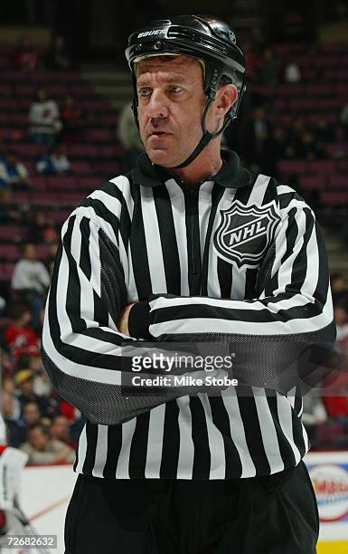 Linesman Pat Dapuzzo looks on during the NHL game between the New Jersey Devils and the Carolina Hurricanes at the Continental Airlines Arena on...