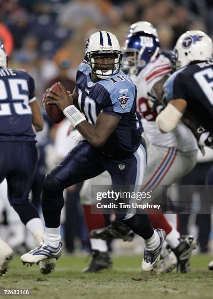 Vince Young of the Tennessee Titans drops back against the New York Giants at LP Field on November 26, 2006 in Nashville, Tennessee. The Titans...