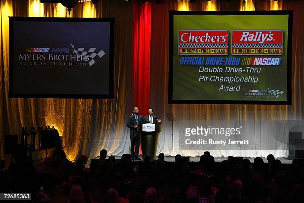 The 2006 NASCAR Nextel Cup Series Champion Jimmie Johnson, receives the Checkers Rally's Double Drive-Thru Pit Championship Award, during the NASCAR...