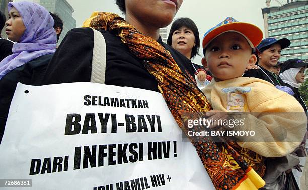 Indonesian mothers join a rally to raise awareness against HIV and AIDS in Jakarta, 01 December 2006 to mark the world AIDS day. The World Health...