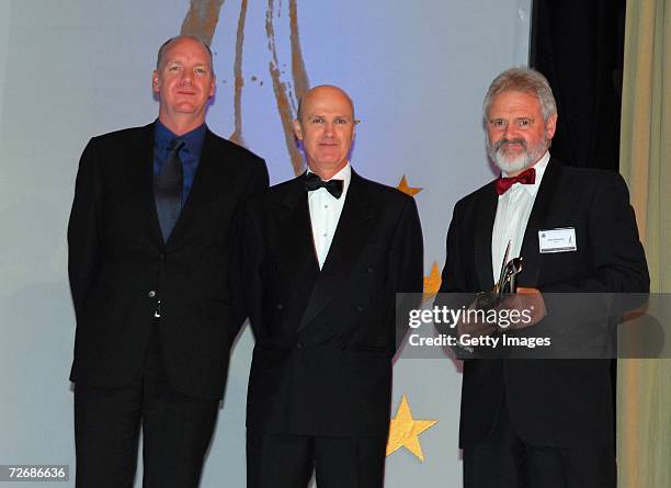John Cameron poses with the award for International Journalism which he accepted on the behalf of winner Mark Simkin at the 2006 Walkley Awards held...