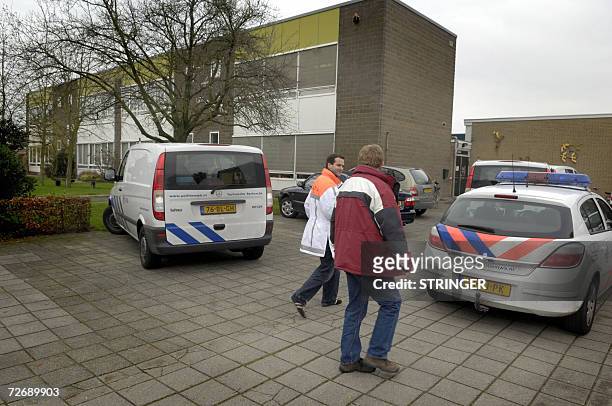Hoogerheide, NETHERLANDS: Police car are parked near the primary school the Klim-Op in the Matthias Wolffstraat of Hoogerheide where a young boy was...