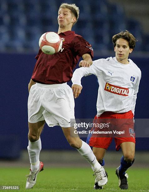 Marco Vorbeck of Rostock tussles for the ball with Matthias Franz of Hamburg during the Third League match between Hamburger SV II and Dynamo Dresden...