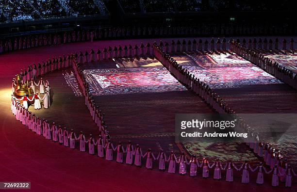 Artists prepare for athlete introductions during the Opening Ceremony of the 15th Asian Games Doha 2006 at the Khalifa stadium on December 1, 2006 in...