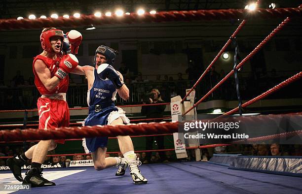 Stewart Langley punches Michael Walsh for the Light Flyweight during the 119th ABA Finals held at York Hall on December 1, 2006 in London, England.