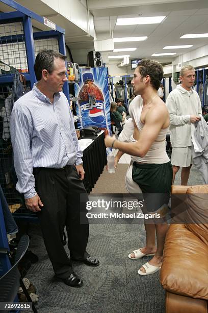 General Manager Billy Beane talks with relief pitcher Huston Street of the Oakland Athletics in the clubhouse after defeating the Minnesota Twins in...