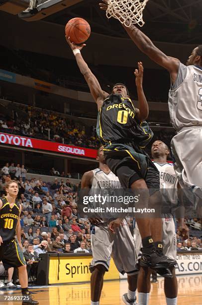 Aaron Brooks of the Oregon Ducks goes to the basket during a college basketball game against the Georgetown Hoyas at Verizon Center on November 29,...