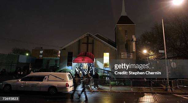 People exit the church after paying their respects at the wake and funeral for shooting victim Sean Bell at the Community Church of Christ December...