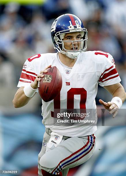 Quarterback Eli Manning of the New York Giants looks to throw the ball downfield in a game against the Tennessee Titans at LP Field on November 26,...