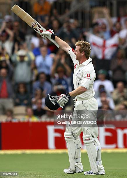England batsman Paul Collingwood waves his bat after scoring a century on day two of the second Ashes cricket Test against Australia at the Adelaide...