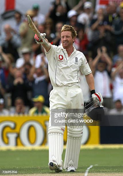 England batsman Paul Collingwood waves his bat after scoring a century on day two of the second Ashes cricket Test against Australia at the Adelaide...