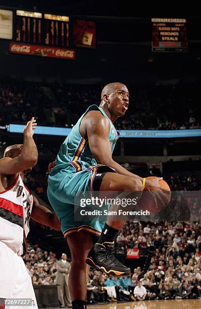Chris Paul of the New Orleans/Oklahoma City Hornets controls the ball during the NBA game against the Portland Trail Blazers at the Rose Garden on...