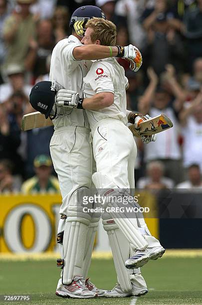 England batsman Paul Collingwood is congratulated by teammate Kevin Pietersen after scoring a century on day two of the second Ashes cricket Test...