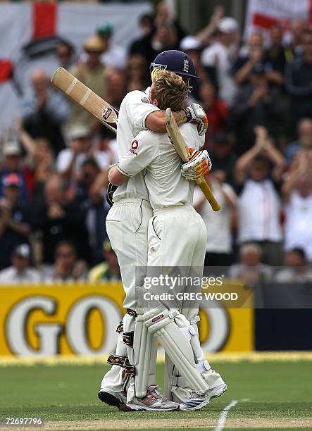 England batsman Paul Collingwood is congratulated by teammate Kevin Pietersen after scoring a century on day two of the second Ashes cricket Test...