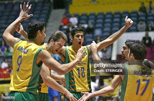 Brazil's players celebrate after scoring a point during their semifinals match against Serbia and Montenegro in the Men's World Volleyball...