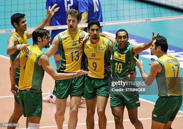 Brazil's players celebrate after scoring a point during the semifinals against Serbia and Montenegro in the Men's World Volleyball Championships in...
