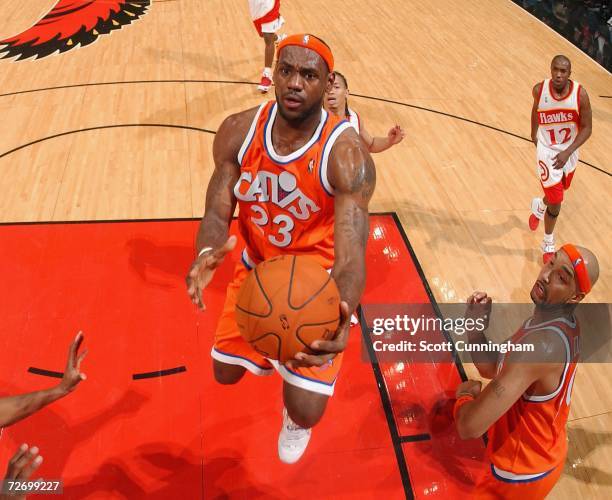 LeBron James of the Cleveland Cavaliers drives to the basket against the Atlanta Hawks at Philips Arena on December 1, 2006 in Atlanta, Georgia. NOTE...