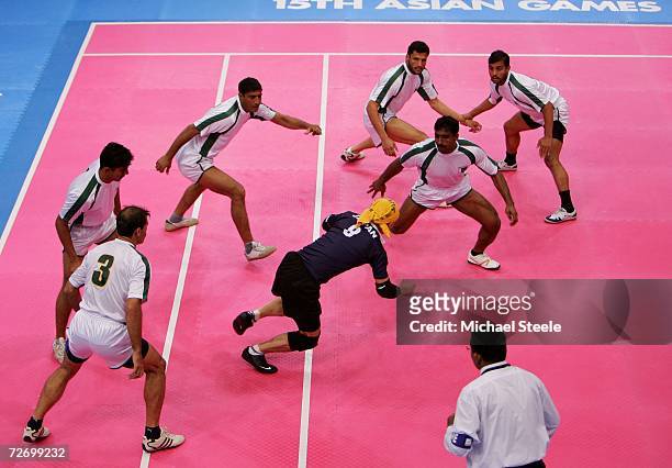 Kokei Ito of Japan faces up to the Pakistan team during the Men's Kabaddi Round Robin match between Pakistan v Japan at the 15th Asian Games Doha...