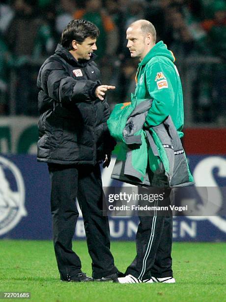 Coach Falko Goetz speaks with Coach Thomas Schaaf of Werder after the Bundesliga match between Werder Bremen and Hertha BSC Berlin at the Weser...