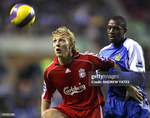 Wigan, UNITED KINGDOM: Wian Athletic's Emmerson Boyce vies with Liverpool's Dirk Kuyt during their English Premiership football match at The JJB...