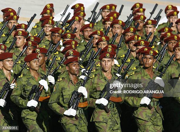 Cuban special forces carrying assault rifles equipped with scopes and silencers take part in a military parade 02 December 2006 at Revolution Square...