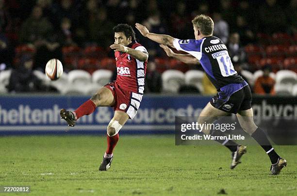 Wilie Walker of Gloucester clears the ball as Tom Cheeseman of Bath tries to block the kick during the EDF Energy Cup game between Gloucester and...