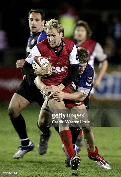 Olly Morgan of Gloucester is tackled during the EDF Energy Cup game between Gloucester and Bath at Kingsholm Stadium on December 2, 2006 in...