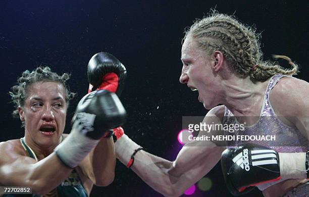 France's Myriam Lamare fights against her compatriot Anne-Sophie Mathis, 02 December 2006 in Paris, during the WBA Women World Boxing championship in...