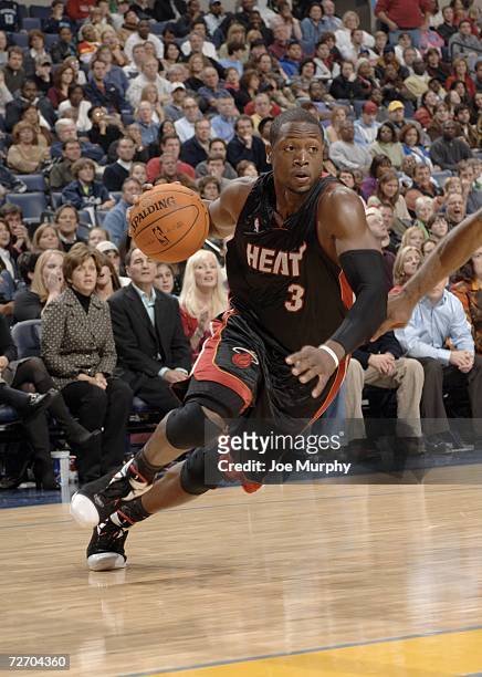 Dwyane Wade of the Miami Heat drives to the basket against the Memphis Grizzlies on December 2, 2006 at FedExForum in Memphis, Tennessee. NOTE TO...