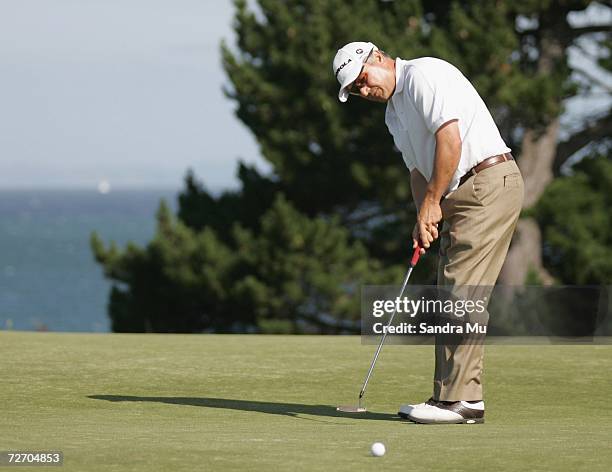 Peter O'Malley of Australia makes a putt on the 16th hole during the final round of the New Zealand Open at Gulf Harbour Country Club on the...
