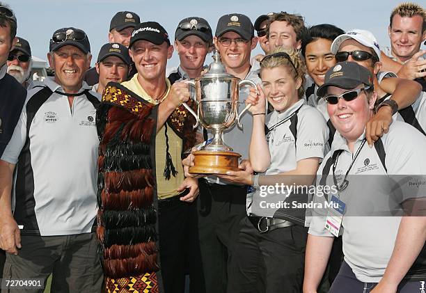 Nathan Green of Australia holds the trophy with green keepers after winning the New Zealand Open at Gulf Harbour Country Club on the Whangaparoa...