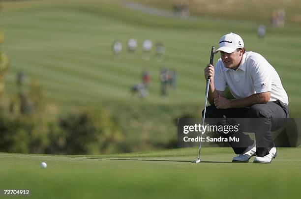 Marcus Fraser of Australia lines up a putt on the 17th hole during the final round of the New Zealand Open at Gulf Harbour Country Club on the...