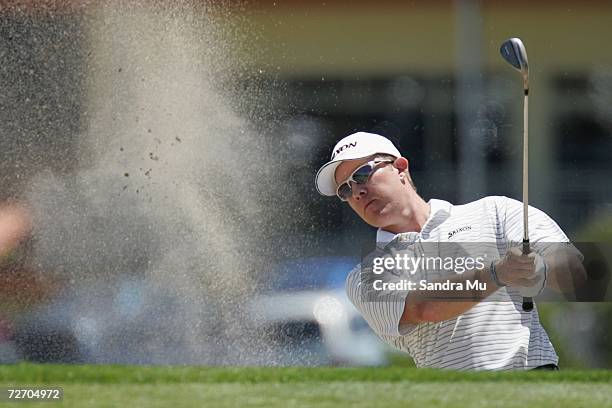 Brad Kennedy of Australia plays a bunker shot on the 6th hole during the final round of the New Zealand Open at Gulf Harbour Country Club on the...