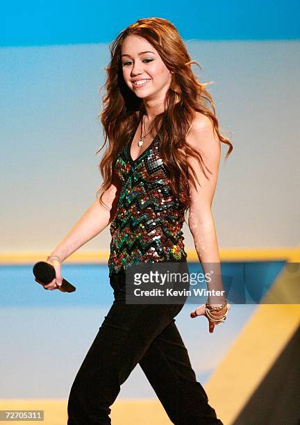 Actress Miley Cyrus walks onstage during the VH1 Big in '06 Awards held at Sony Studios on December 2, 2006 in Culver City, California.