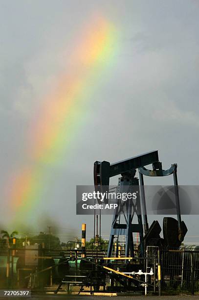 An oil pump is seen in Cabimas village, near PDVSA Oriental main tank yard in the outskirts of Maracaibo, in Zulia state, Venezuela, 02 December...