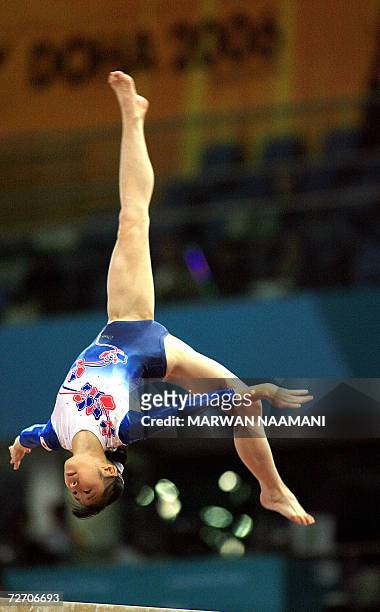 Japanese gymnast Miki Uemura performs her beam routine at the Women's Artistic Gymnastics team final 03 December at the Aspire compound at the 15th...