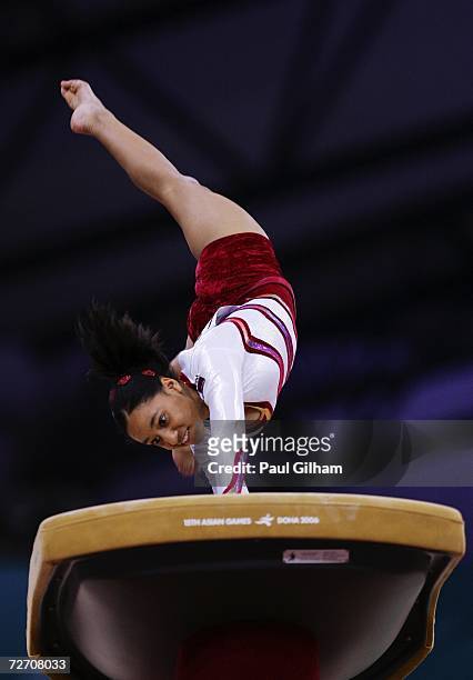 Shegun Ali of Qatar competes on the vault during the Women's Artistic Gymnastics Team Final and Individual Qualiification at the 15th Asian Games...