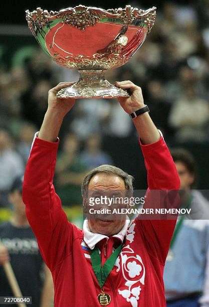 Moscow, RUSSIAN FEDERATION: Russia's tennis team captain Shamil Tarpishchev holds the trophy during the awarding ceremony of the final Davis Cup...