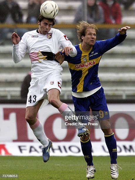 Andrea Barzagli of Palermo and Zlatan Muslimovic of Parma in action during the Serie A match between Parma and Palermo at the Stadio Ennio Tardini on...
