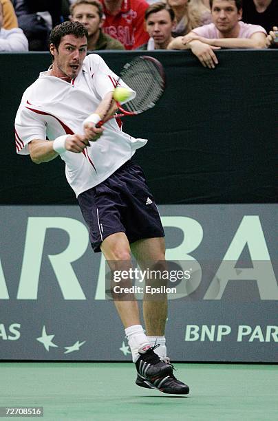 Russia's Marat Safin returns a service to Argentinian Jose Acasuso during the final match of the Davis Cup tennis tournament December 03, 2006 in...