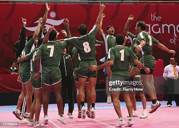 Pakistan celebrates after winning their their Men's Kabaddi Round Robin Match Five against Bangladesh at the 15th Asian Games Doha 2006 at Aspire...