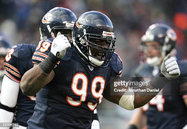 Tank Johnson of the Chicago Bears fires up the crowd during a game against the Minnesota Vikings on December 3, 2006 at Soldier Field in Chicago,...