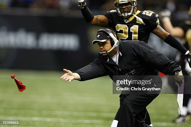Head coach Sean Payton of the New Orleans Saints tosses a red flag to challenge a call in the second half against San Francisco 49ers December 3,...