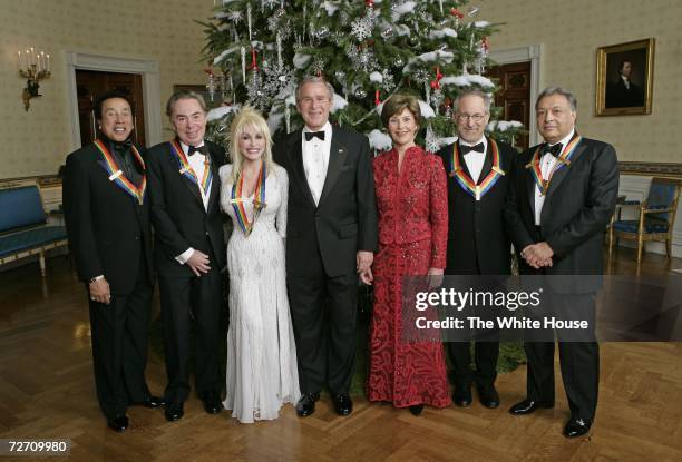 In this handout provided by The White House, President George W. Bush and Mrs. Laura Bush stand with the Kennedy Center honorees singer and...